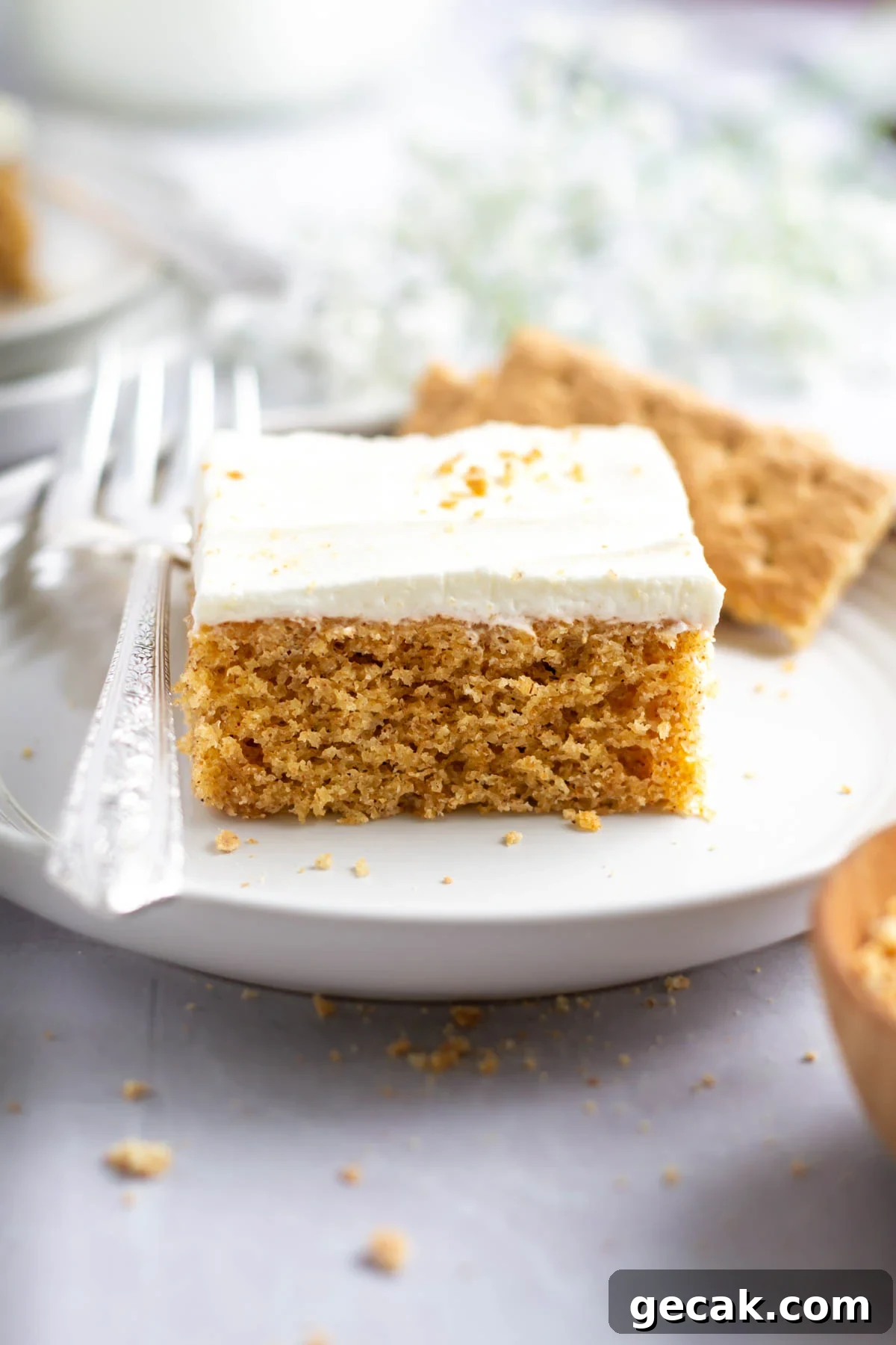 No-Bake Graham Cracker Cake Recipe: Layered Dessert with Creamy Filling 17 slice of graham cracker cake on a plate with a fork