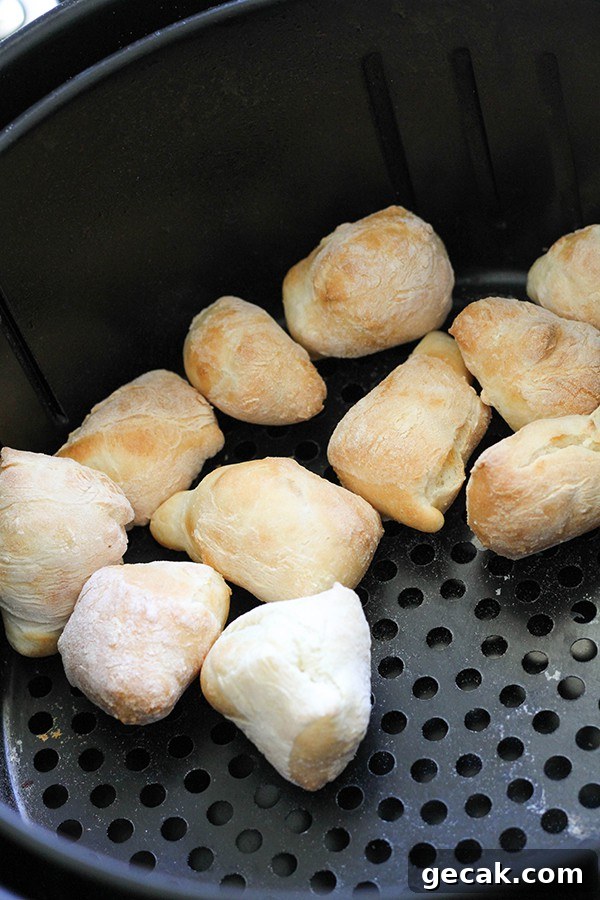 pretzel bites in an air fryer basket.