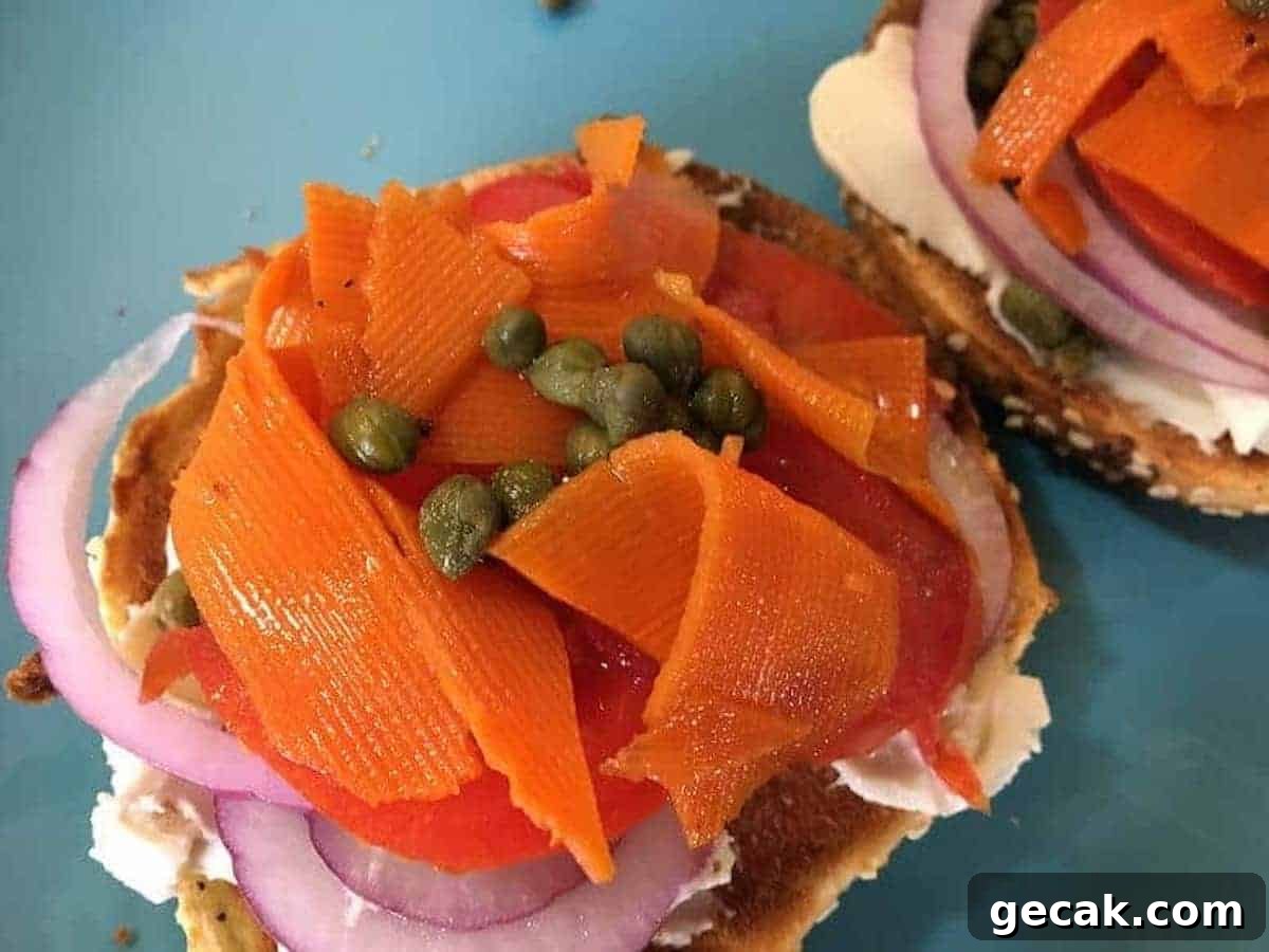 Carrot Lox  Recipe on a bagel with vegan cream cheese, red onions, and capers. 