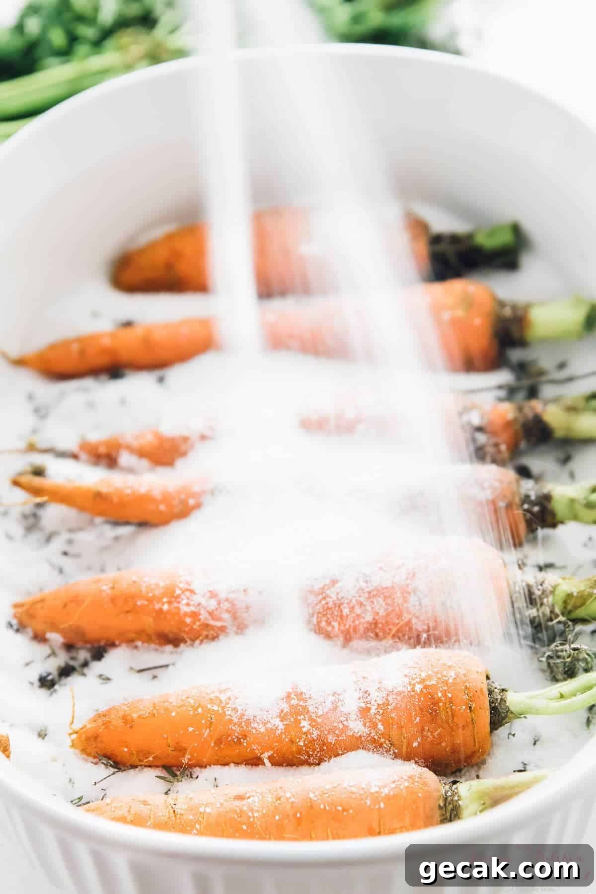 Pouring salt over carrots for carrot lox.