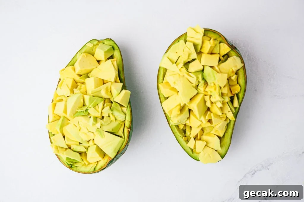 diced tropical avocado in avocado skin