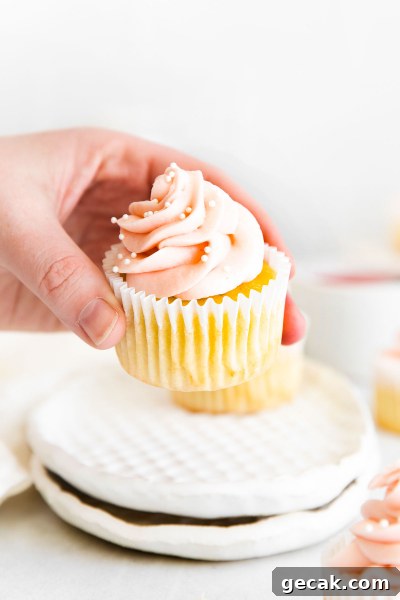 rhubarb cupcake being held up