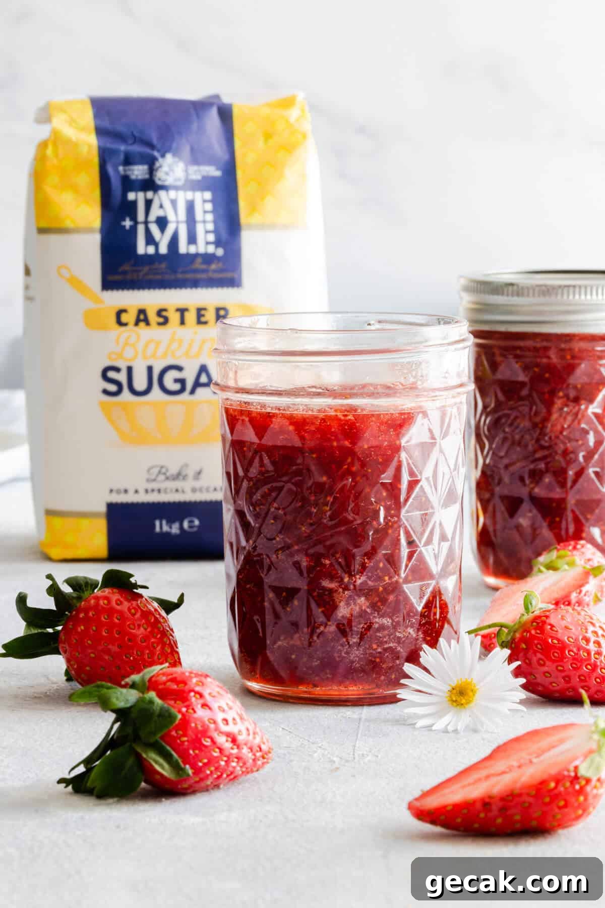 Homemade Strawberry Jam Recipe: Small-Batch Method for Fresh Flavor 5 straight ahead shot of open jar with strawberry jam inside and another jar in the back