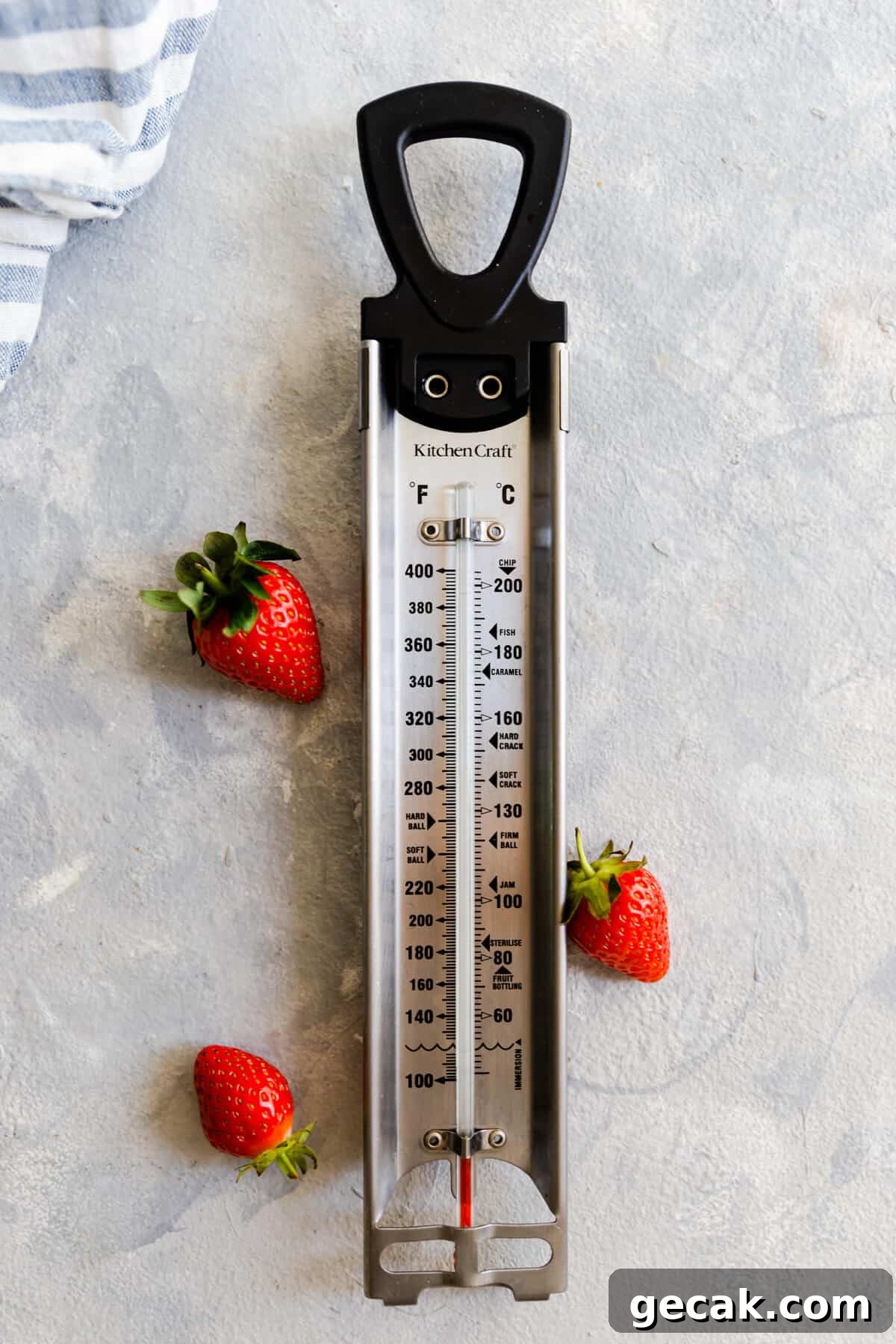 Homemade Strawberry Jam Recipe: Small-Batch Method for Fresh Flavor 7 top view of a kitchen thermometer with few strawberries next to it