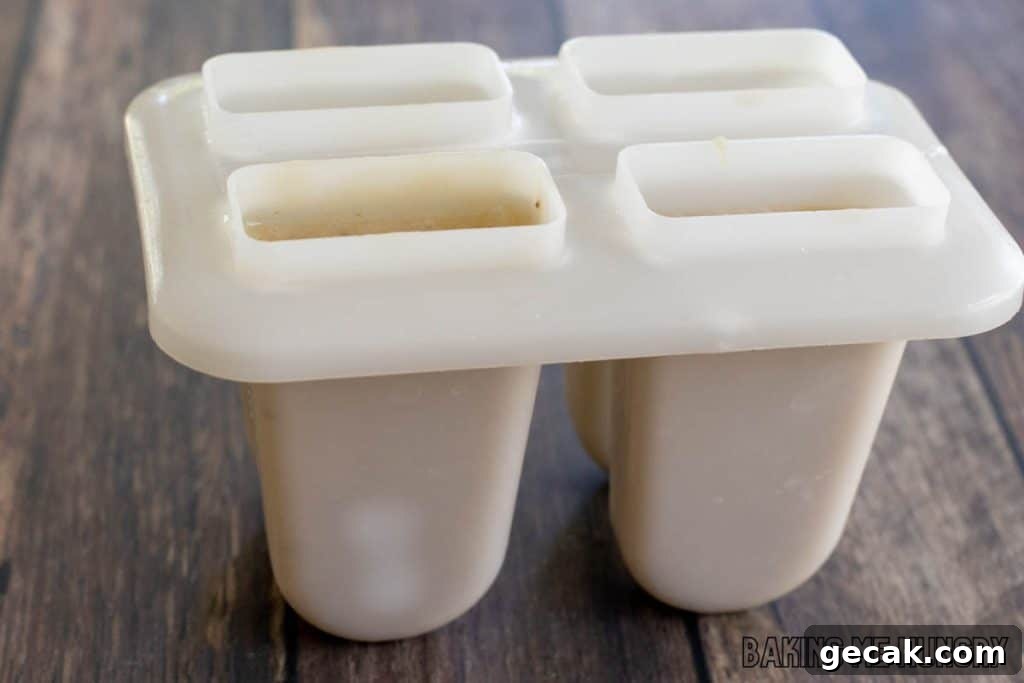ice pop mixture added to molds