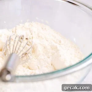 Gluten-Free All-Purpose Flour Blend Without Xanthan Gum 8 Glass bowl filled with white flour and a whisk