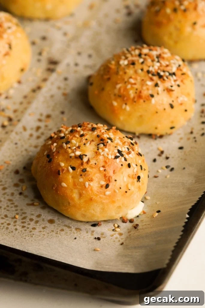 close up shot of a baked everything bagel bite on a baking sheet