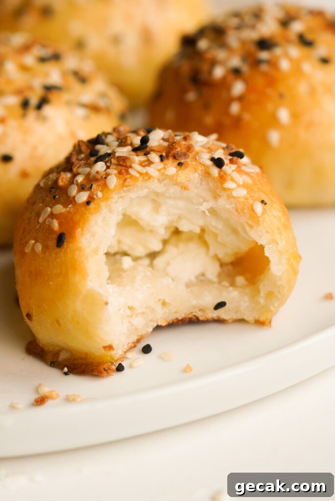 cream cheese stuffed bagel bite with a bite taken out of it