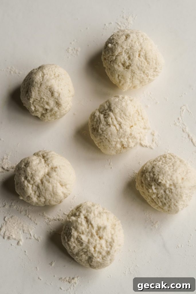 6 bagel bite dough balls on a lightly floured surface