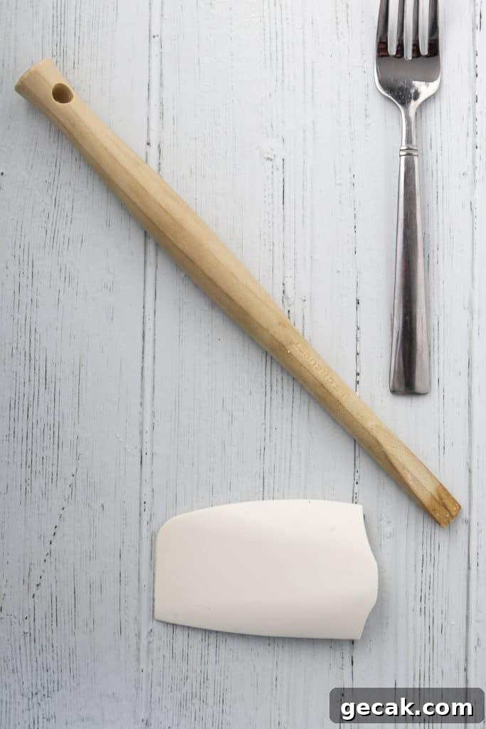 Raspberry Hazelnut Heart Cookies Recipe 5 Spatula and spoon on a wooden surface