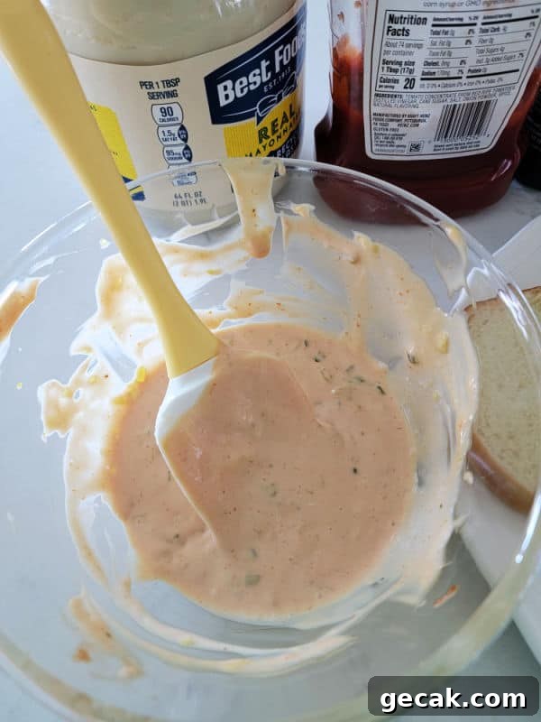 mayo and ketchup containers next to a glass bowl with In n Out Burger Spread and a spatula