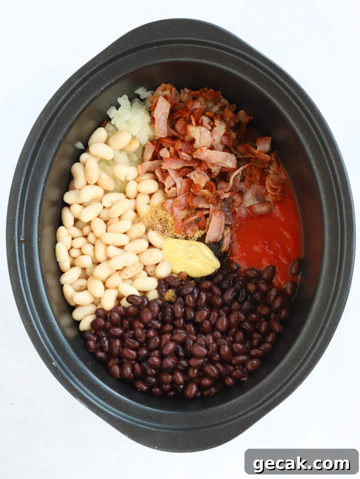 Slow Cooker Baked Beans Recipe — Perfect BBQ Side Dish 3 Raw ingredients for homemade baked beans cooked in the slow cooker