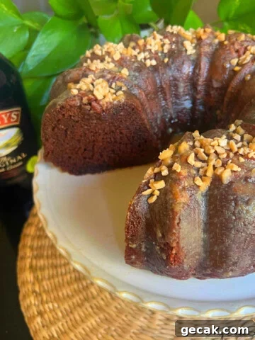 Baileys Chocolate Bundt Cake, sliced, on a pedestal.