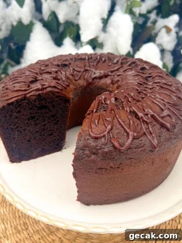 Brownie Bundt Cake, Sliced, on a cake pedestal.