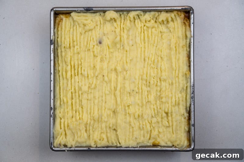 Spreading the mashed potatoes