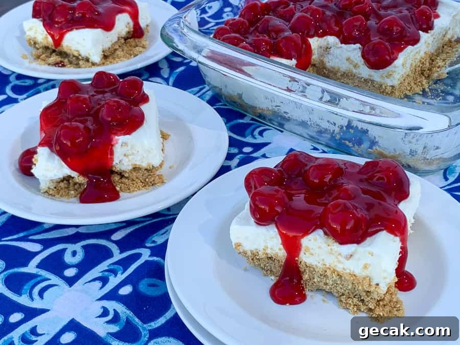 Several pieces of cherry delight dessert next to pan full