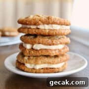 A stack of 3 oatmeal cream pies on a dessert plate.