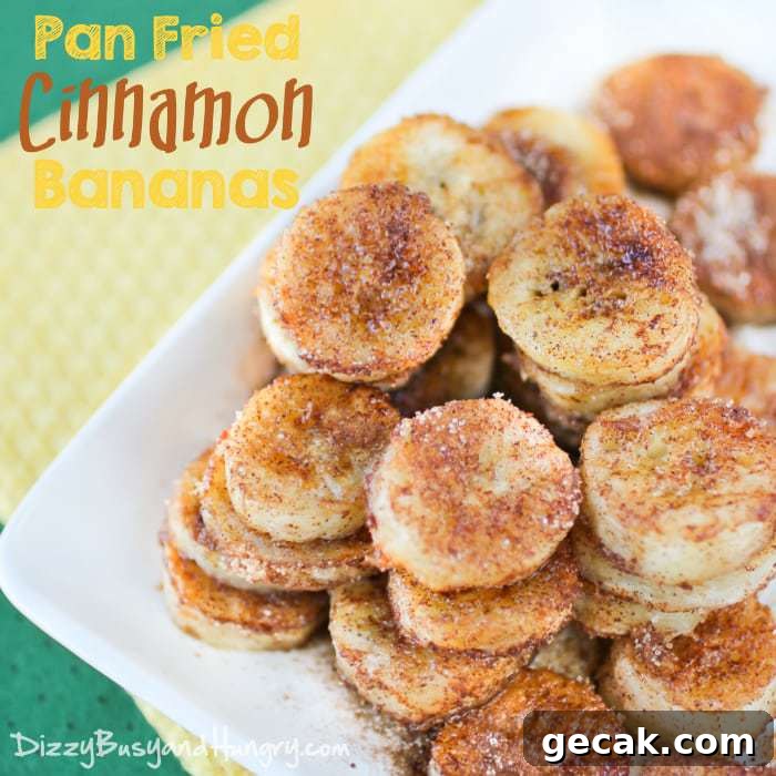 Close up view of pan fried cinnamon bananas on a white plate on a yellow and green cloth. 