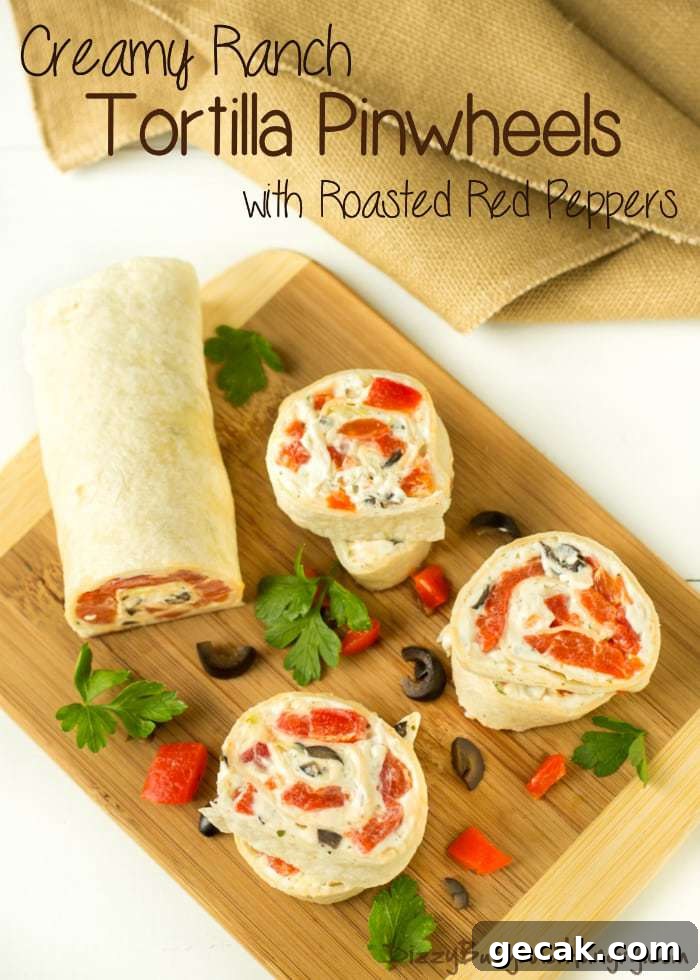Overhead view of creamy ranch tortilla pinwheels on a wooden cutting board