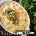 Overhead shot of homemade queso dip in an oval bowl