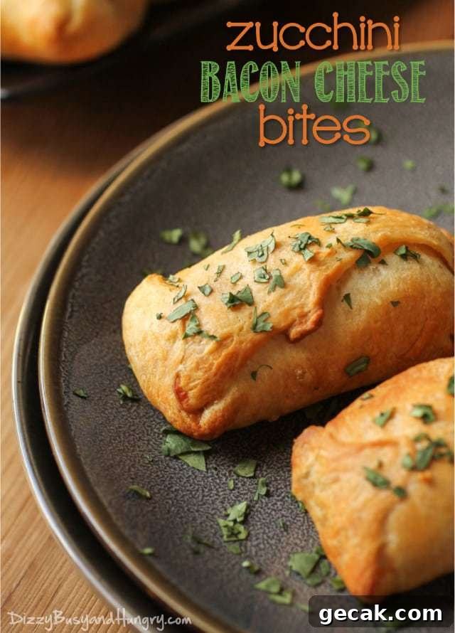 Side view of zucchini bacon cheese bites on a brown plate garnished with herbs. 
