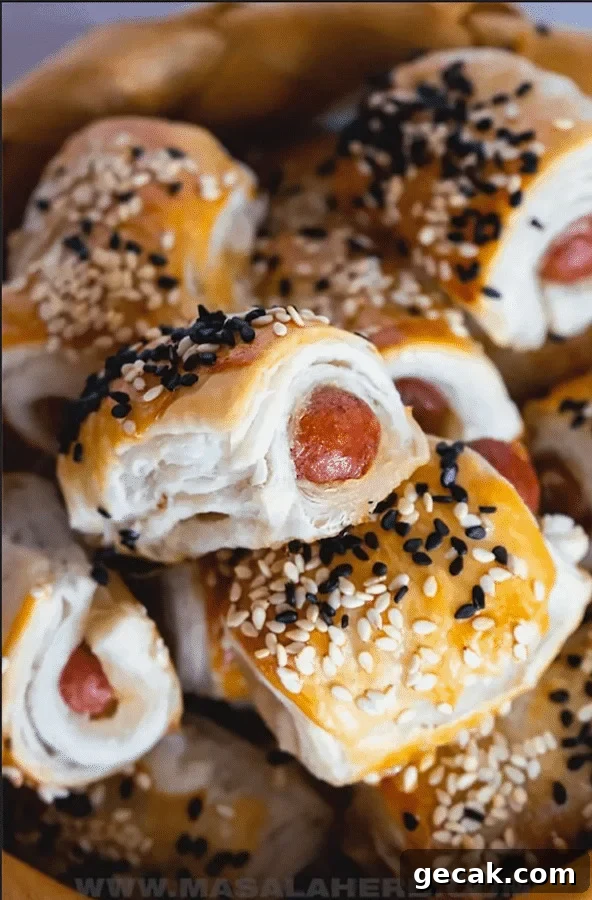 top view of pigs in a blanket wrapped in puff pastry - after school snacks