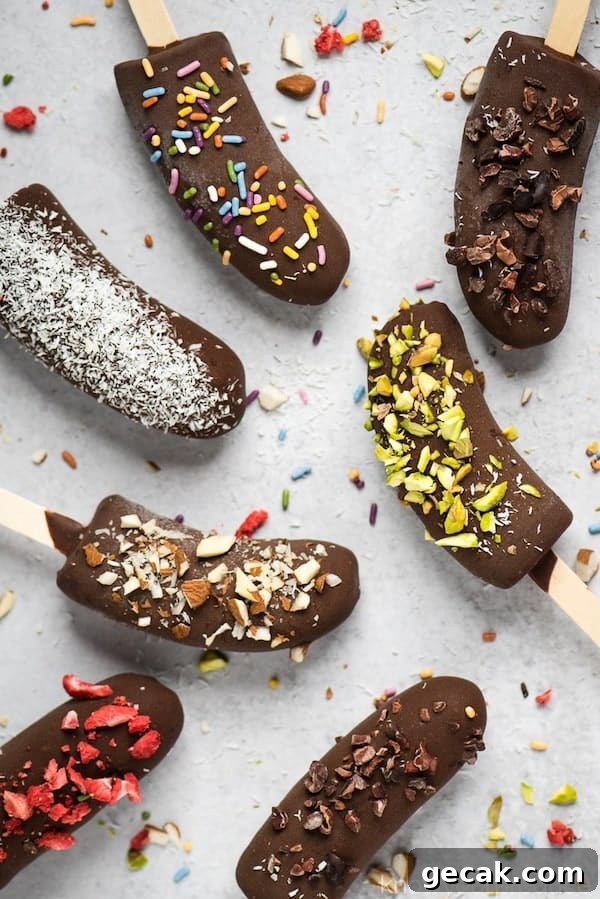 Top view of frozen chocolate bananas with popsicle sticks