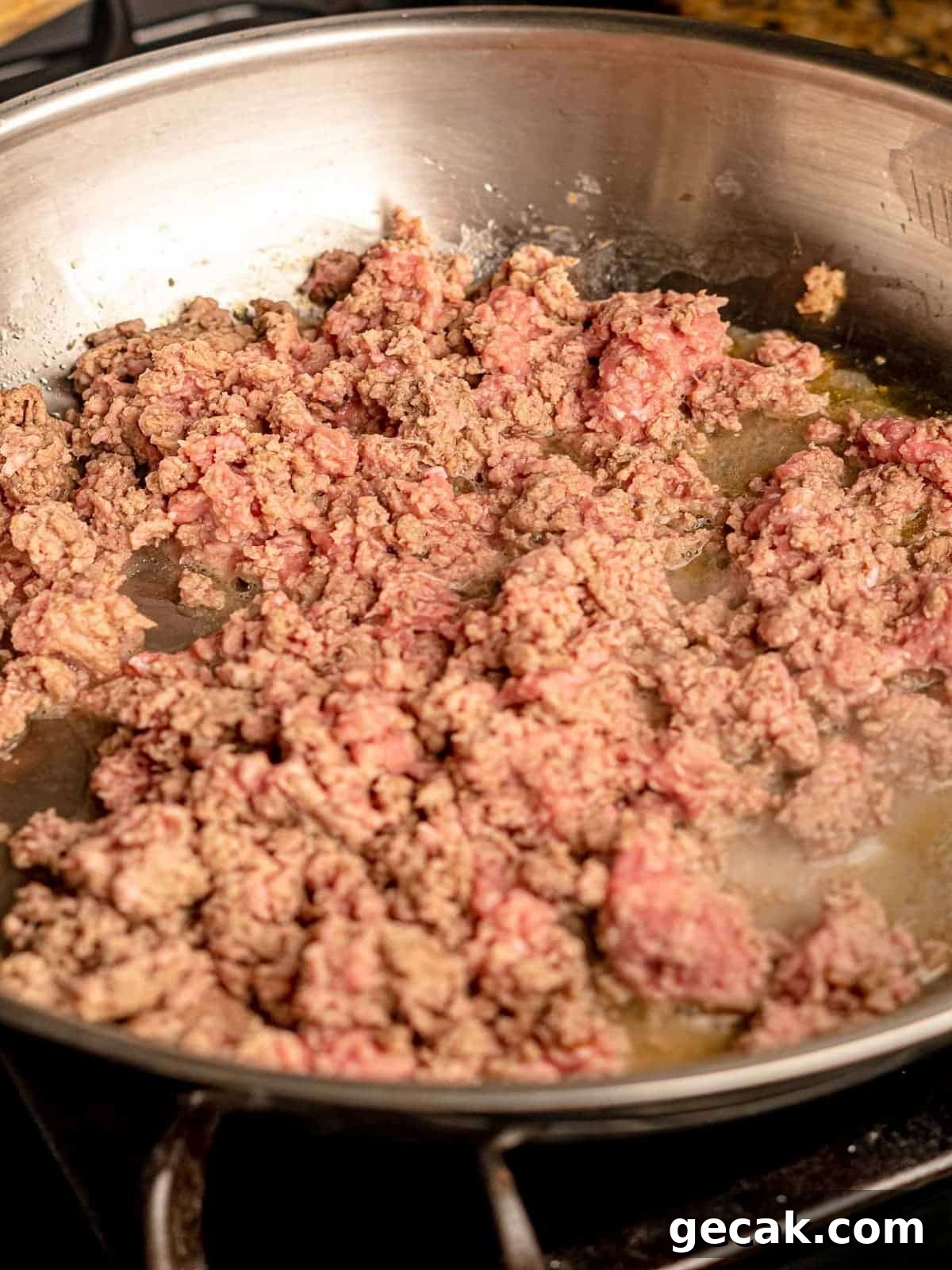 Ground turkey in a skillet.