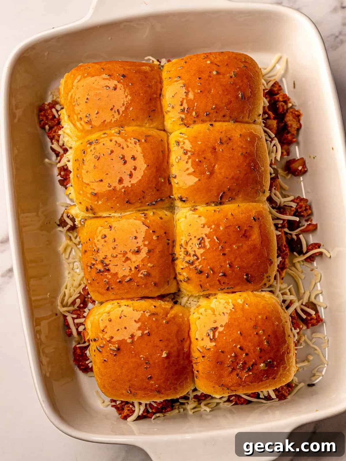 Sliders topped with melted butter.
