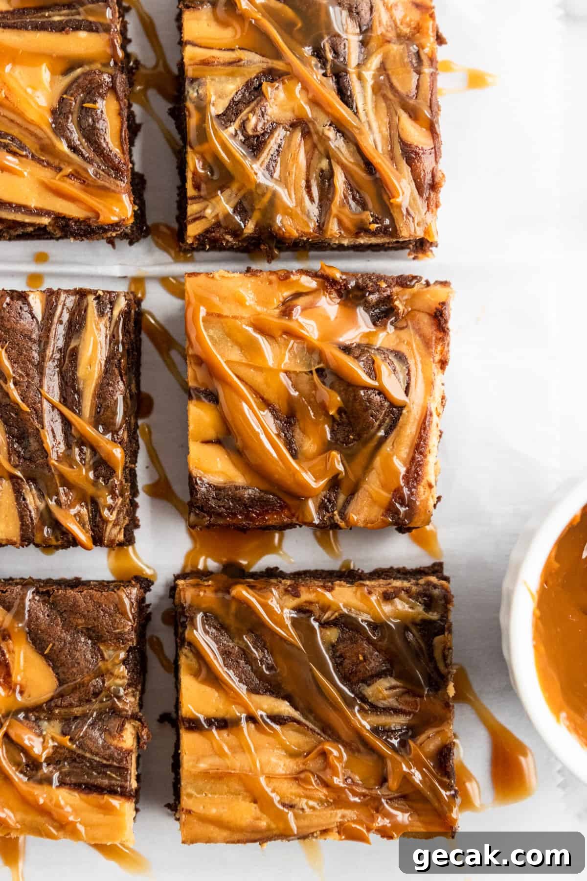 Salted Dulce de Leche Cream Cheese Brownies Recipe 9 Overhead shot of brownies with dulce de leche drizzle.