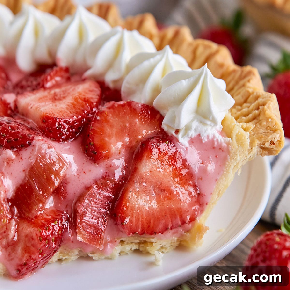 Creamy Strawberry Rhubarb Pie Recipe for Summer Entertaining 2 Strawberry Rhubarb Pie with glossy strawberry slices, pink rhubarb chunks, creamy filling, and golden pie crust