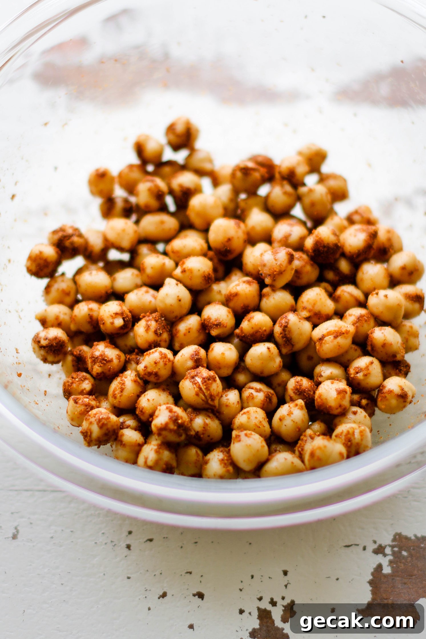 chickpeas in a glass bowl covered in Tandoori Masala seasoning by Flora & Vino 
