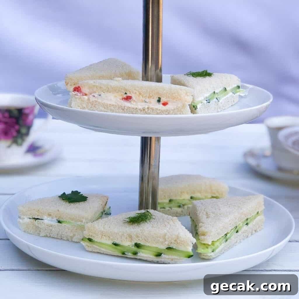Tiered serving platter with English tea finger sandwiches.