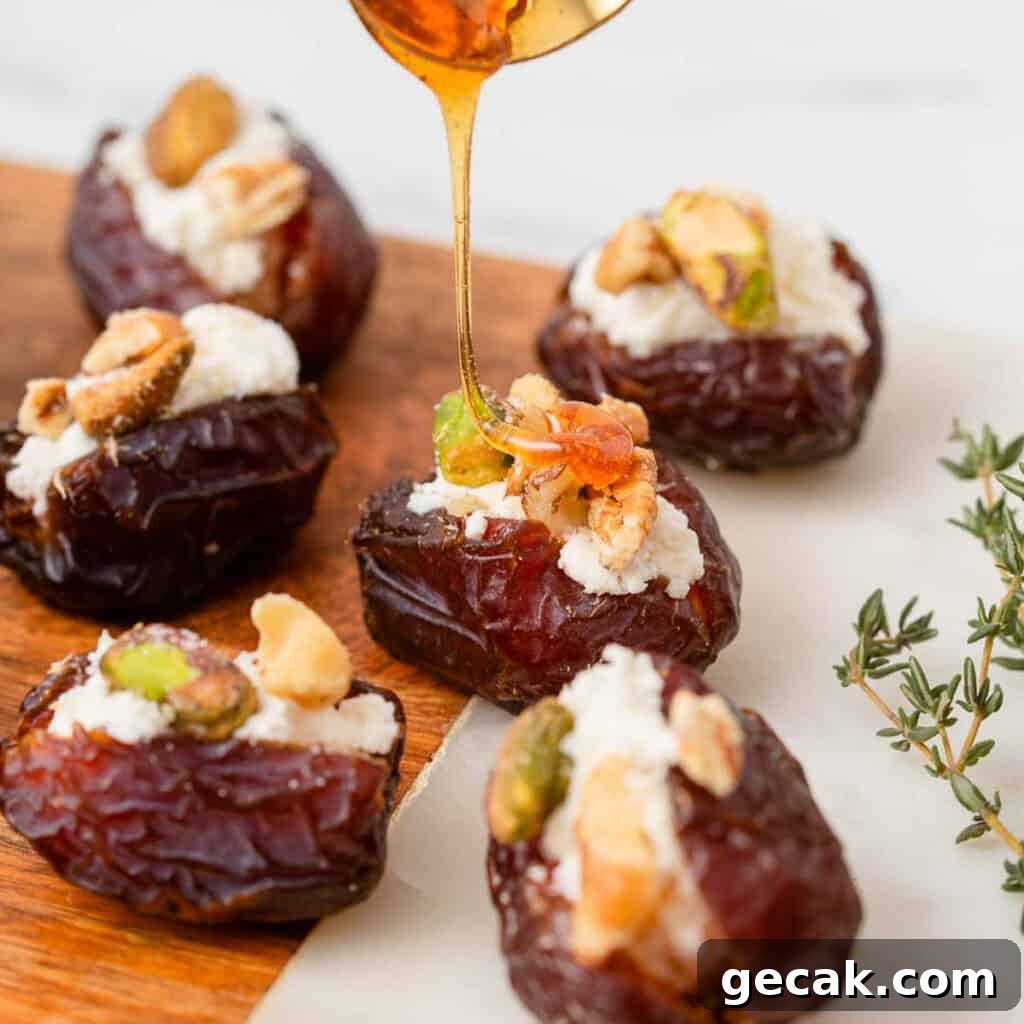 Stuffed dates drizzled with honey on table.