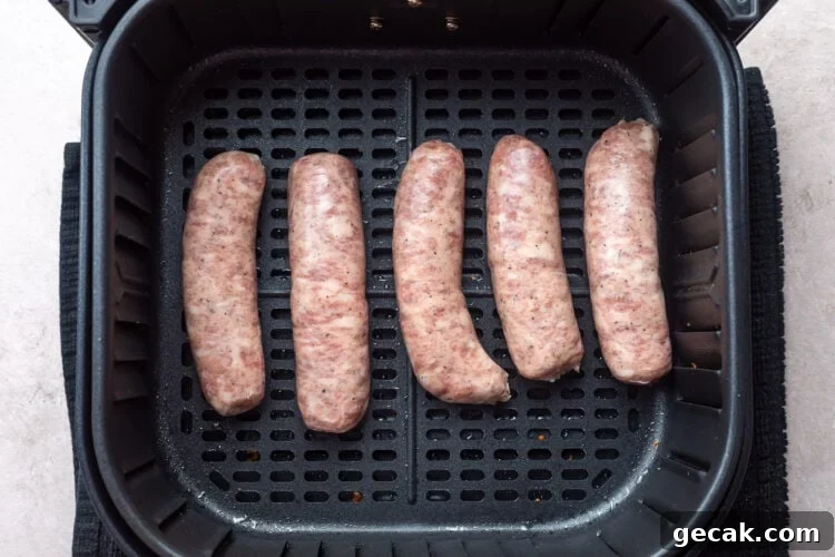 Crispy Air Fryer Italian Sausage Recipe for Quick Dinner 6 5 uncooked Italian sausage links in an air fryer basket.
