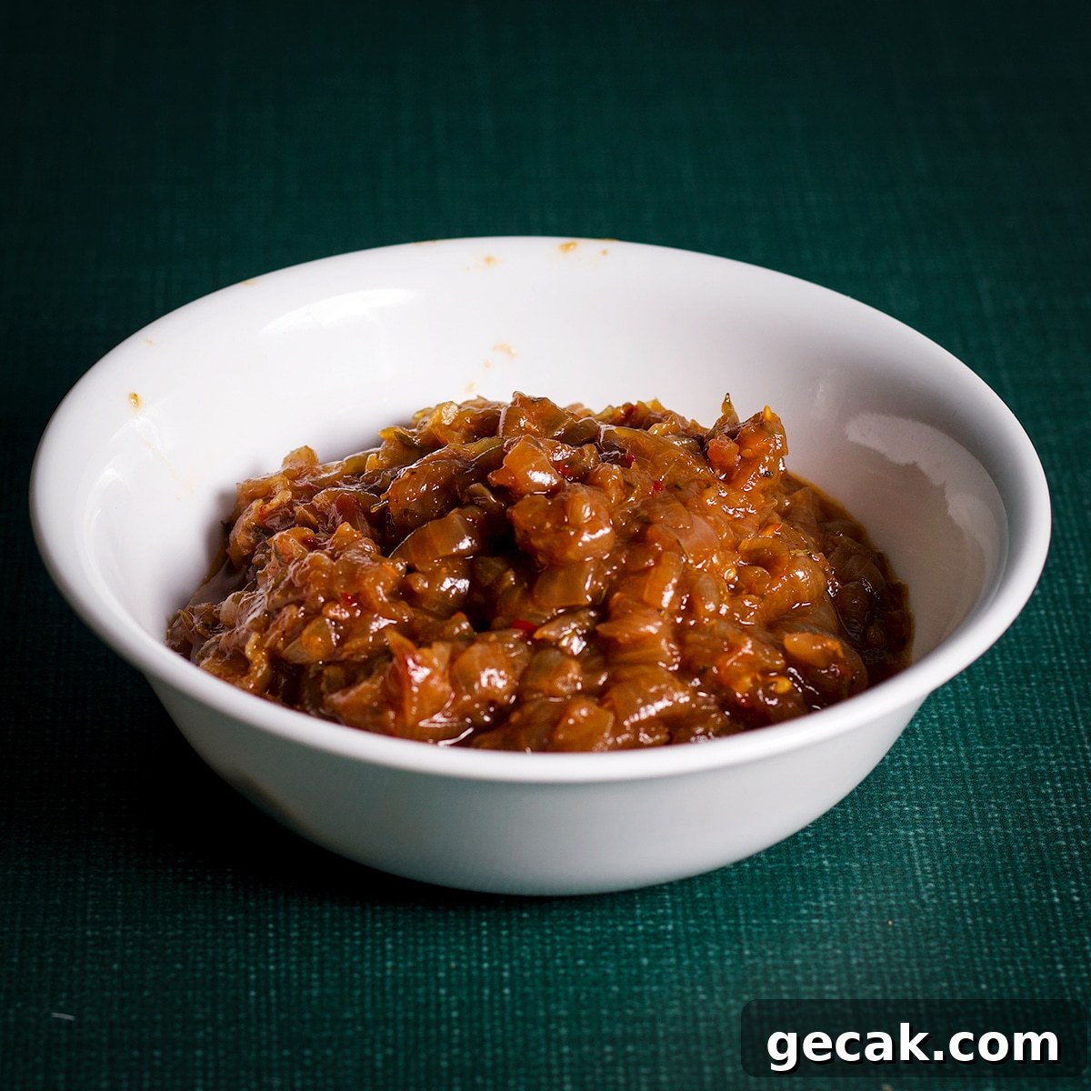 A small bowl filled with cooked onions.