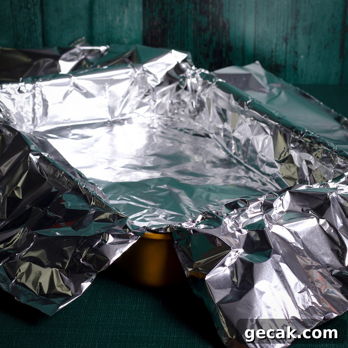 A pan that's been lined with aluminum foil so the foil overhangs the sides of the pan by several inches.