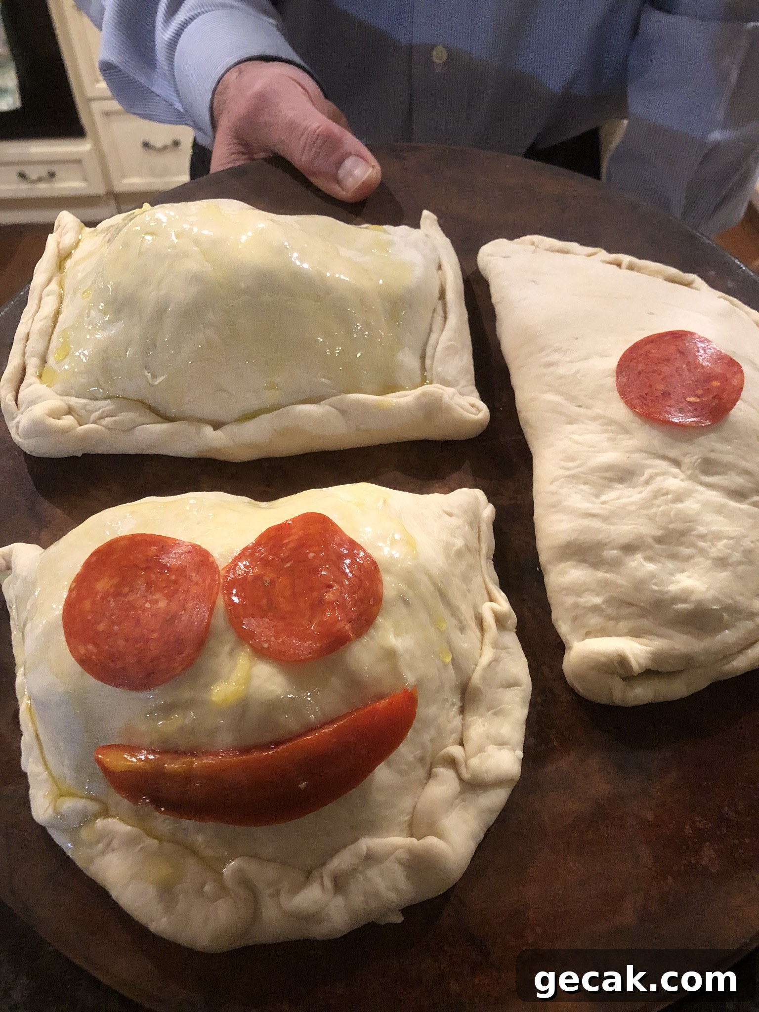 Homemade calzone stuffed with Mozzarella and other fillings 