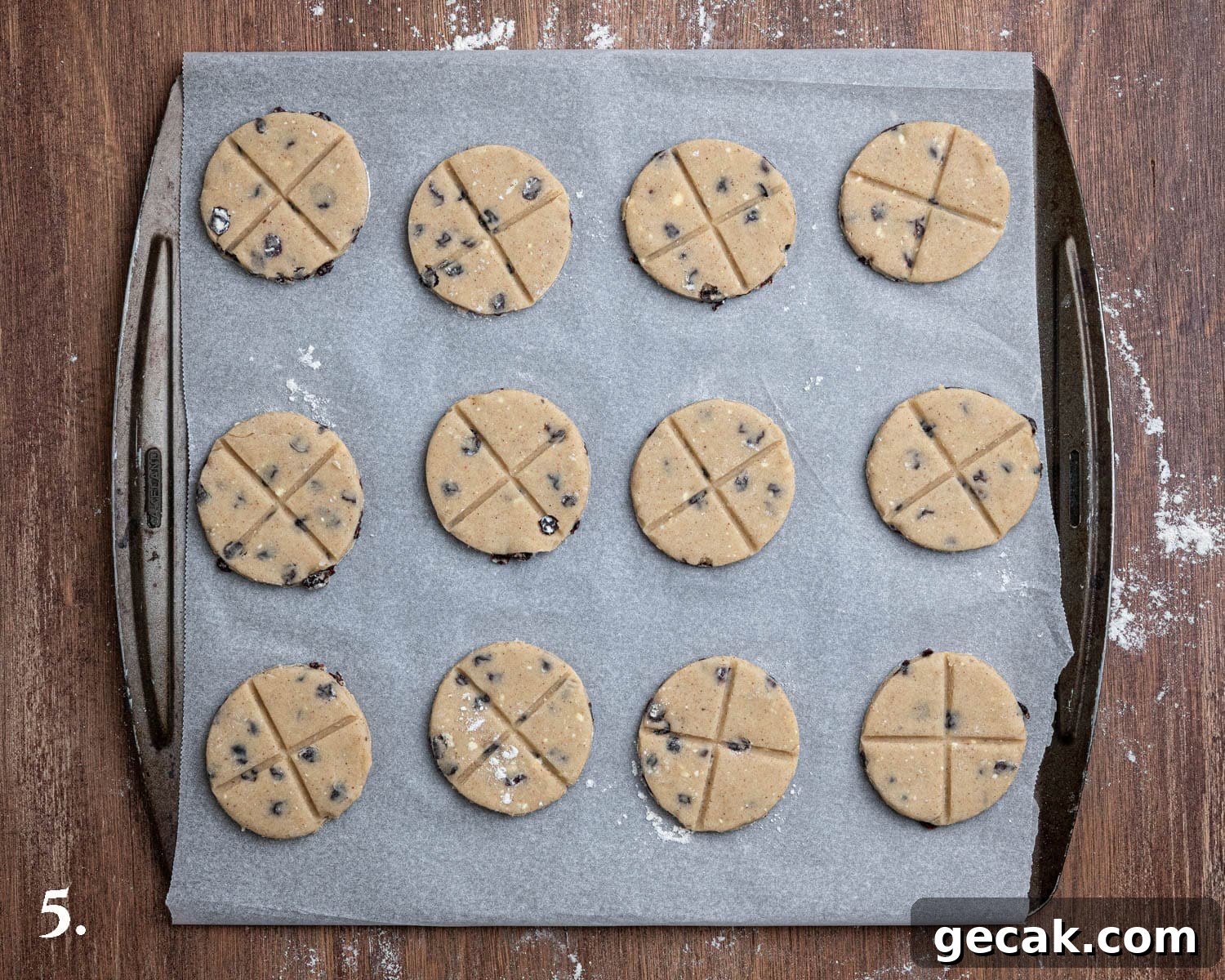 Step 5, the soul cakes on a baking sheet marked with crosses.