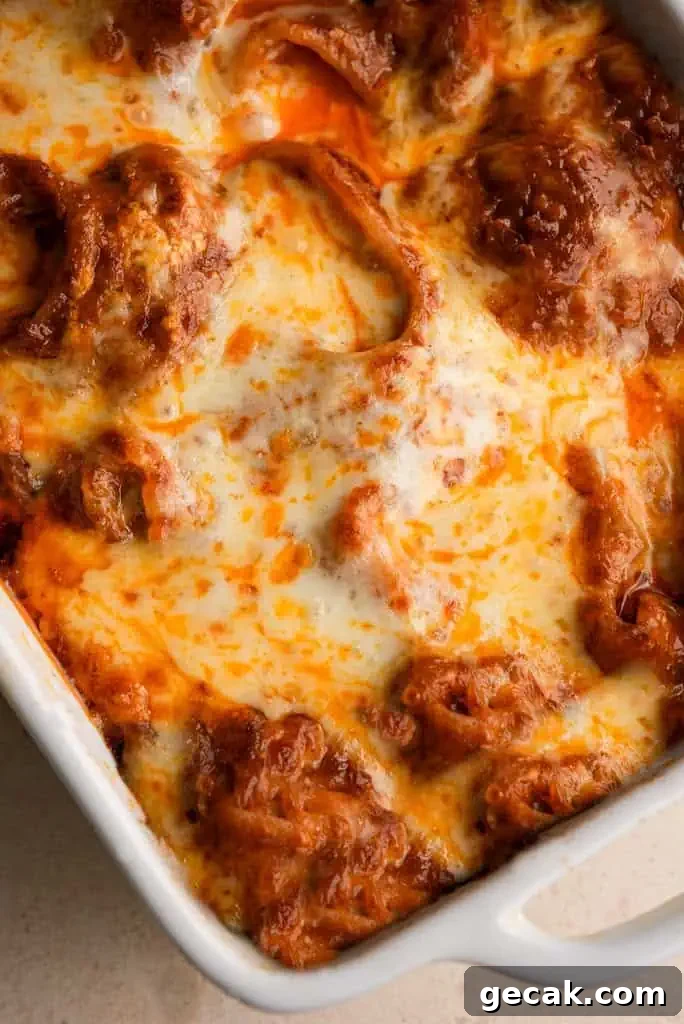 Vodka Ricotta Stuffed Pasta Bake with Creamy Tomato Sauce 11 Golden and bubbly baked pasta in a dish, with melted cheese and rich vodka sauce covering the stuffed shells.
