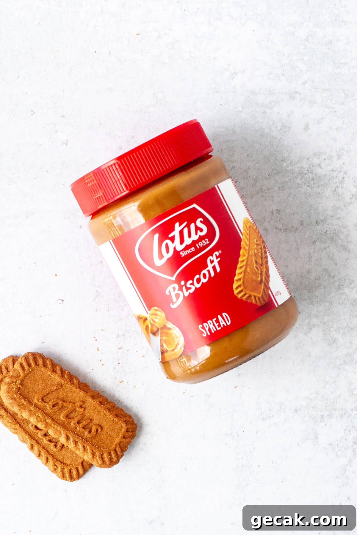Jar of cookie butter with 2 Lotus cookies