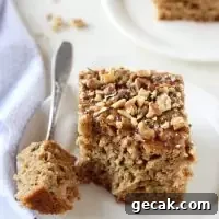 Moist and fluffy honey cinnamon zucchini bread! With whole wheat flour, applesauce and walnuts! Perfect for breakfast, snacking or even dessert!