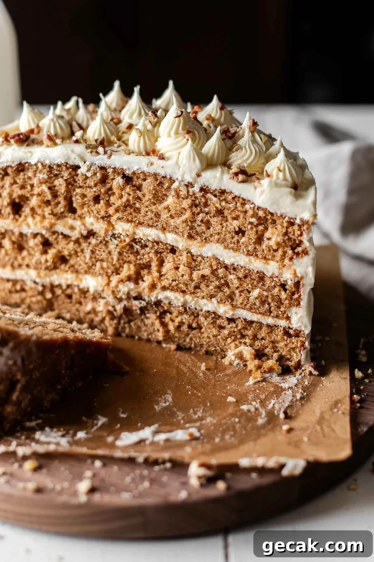 sliced maple cake on wooden cake plate