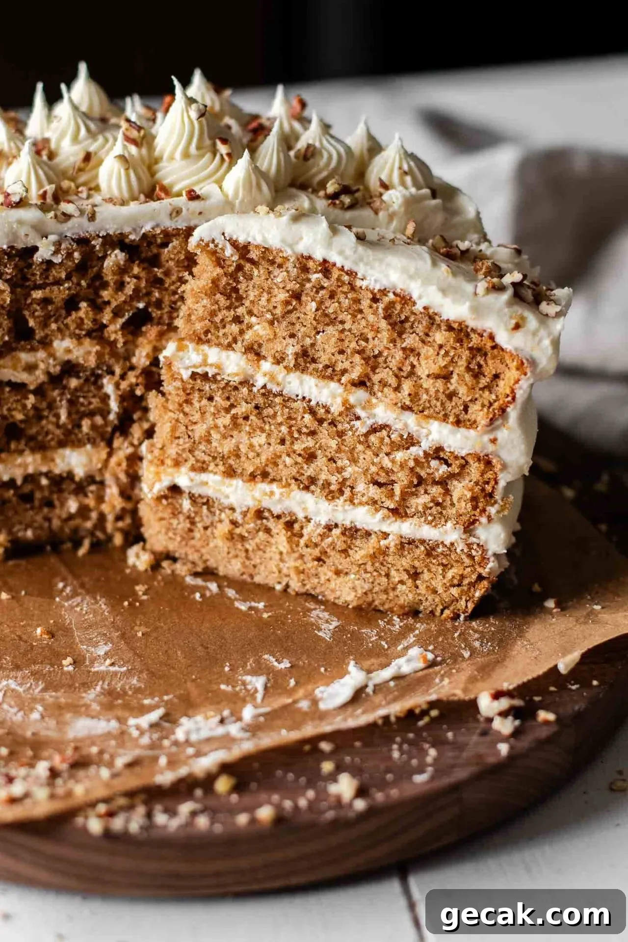 sliced maple cake on wooden cake plate