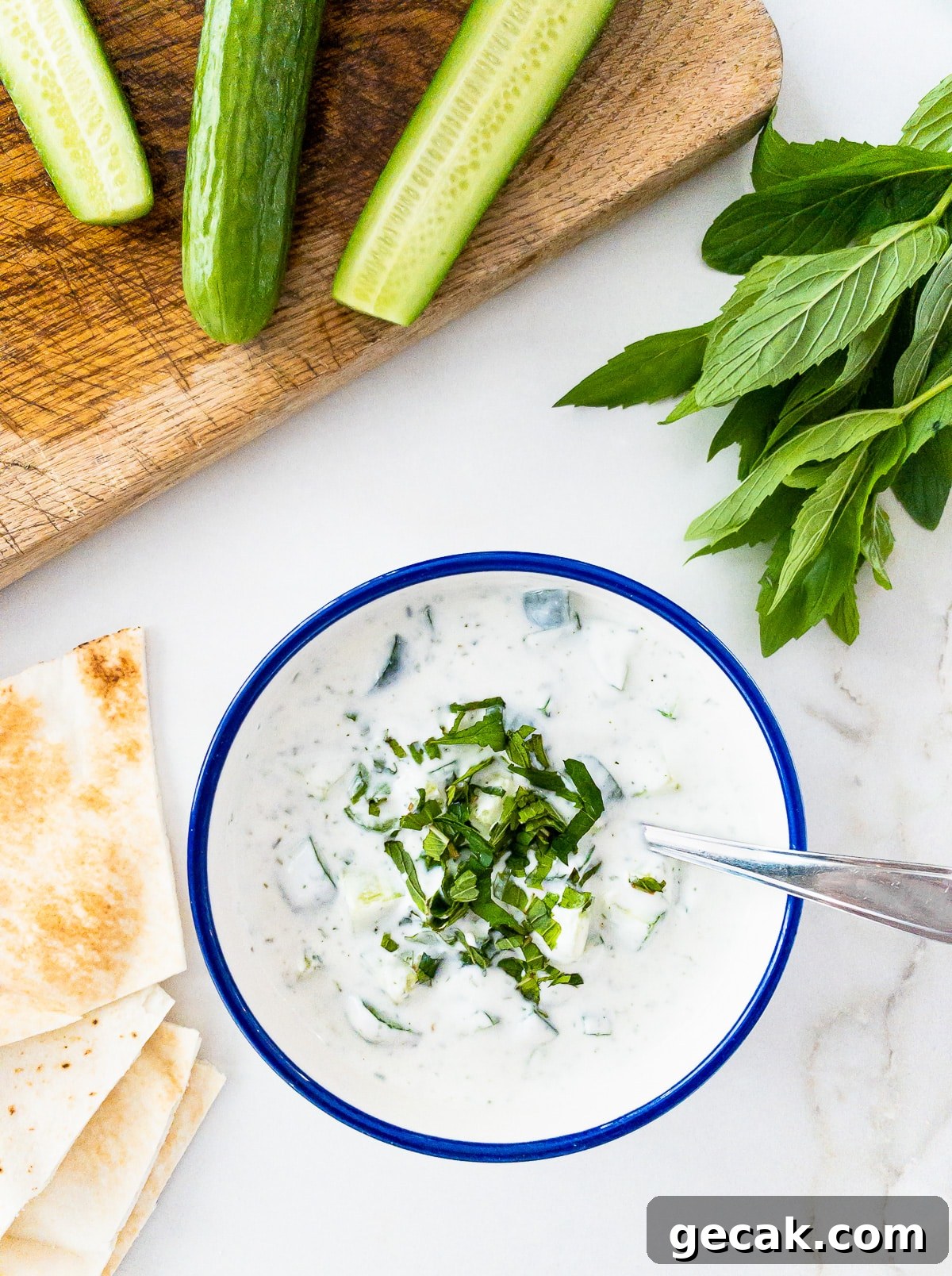 Bowl of cucumber, yogurt and mint salad.