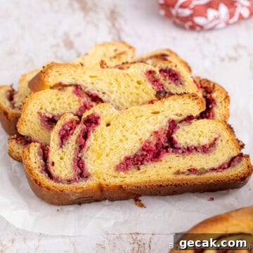 Slices of Cranberry Walnut Bread with swirls of cranberries.