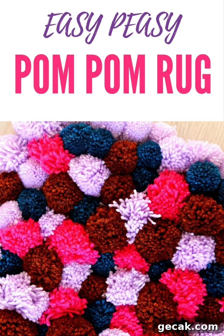 DIY Pom Pom Rug made with yarn pom poms in pink, navy blue, brown and lilac
