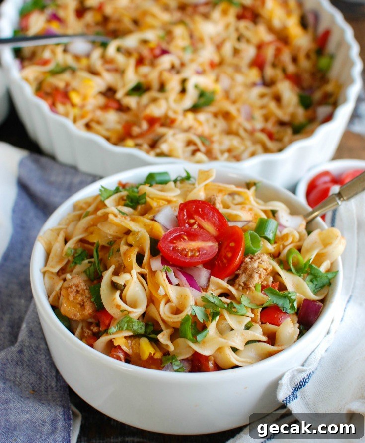 Easy Mexican Noodle Casserole with No Yolks Noodles, vegetables, ground turkey, spices and cheese.