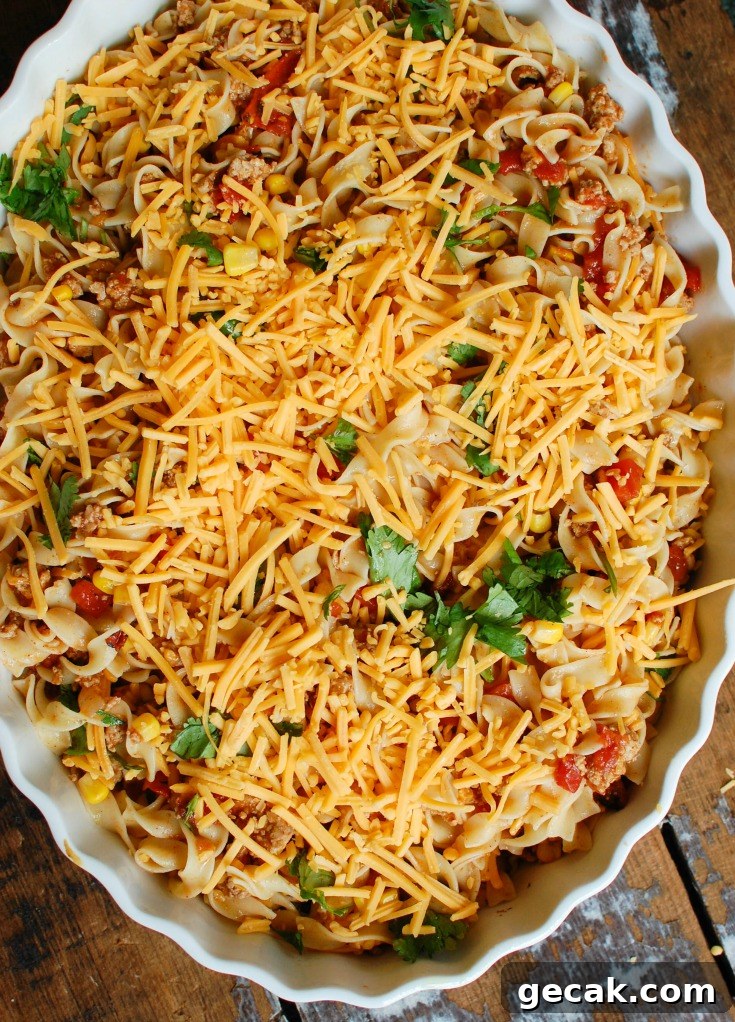 Casserole baking until cheese bubbles.