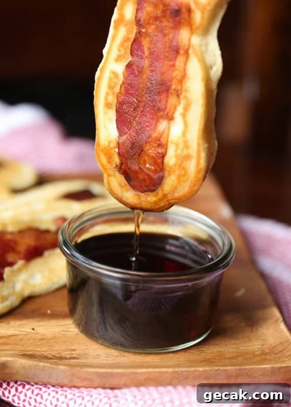 Pancake Bacon Dippers! A soft pancake surrounds a crispy piece of bacon that you can dip right in maple syrup!